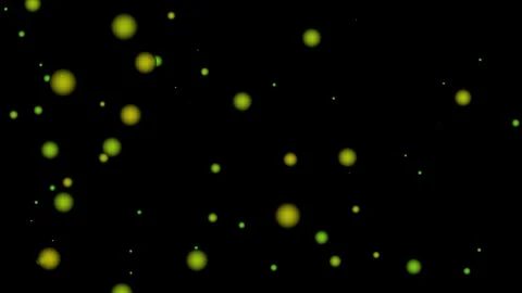 A dark background with scattered glowing green and yellow circular lights c.. Stock Footage 324976972