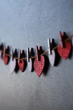 On a dark background on a string of hearts 스톡 사진