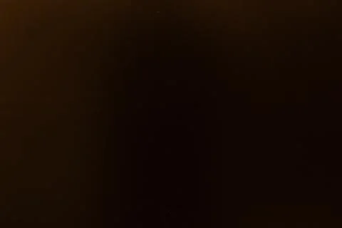 Dark background with subtle texture, hinting at depth and simplicity for Foto stock