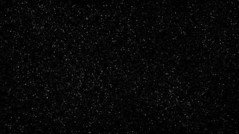 On a dark background, white particles light up and go out. Imitation of glitter Stock Footage 267022504