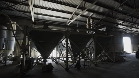 Dark barn on the farm. With tractor. wheat and farm machines Video stock 157675868