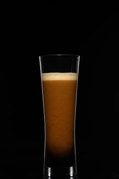 Dark beer on a black background Stock Photos