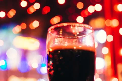 Dark beer in the  colored light background Foto stock