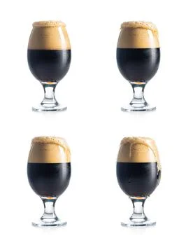 Dark beer with overflowing foam head isolated on white background. Four var.. Stock Photos