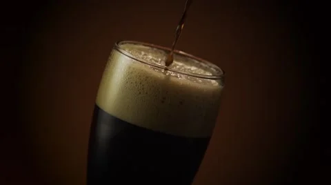 Dark Beer Pouring Over Video stock 63662508