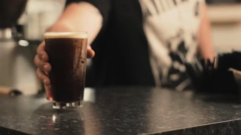 Dark Beer/Coffee On Table Stock Footage 97201506