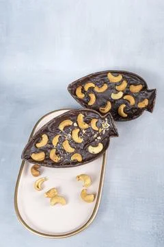 Dark Belgian chocolate Easter egg, filled with cupuau jam and cashew nuts 2.. Stock Photos