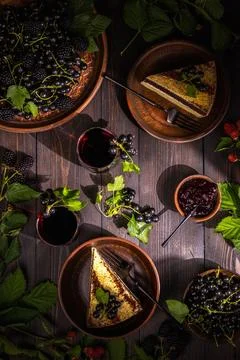 Dark berries cake dessert on rustic wooden table Stock Photos