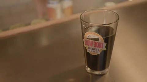Dark Beverage in Glass on Bar Counter in Beijing Indoor Drink Service Scene Stock Footage 345758037