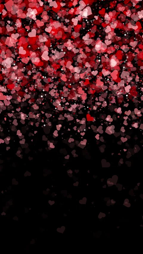 Dark black background of falling small hearts with particle in red colors. Loop Stock Footage 297988037