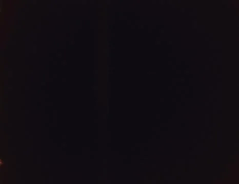 Dark black background presenting a subtle light glow Stockfoto's