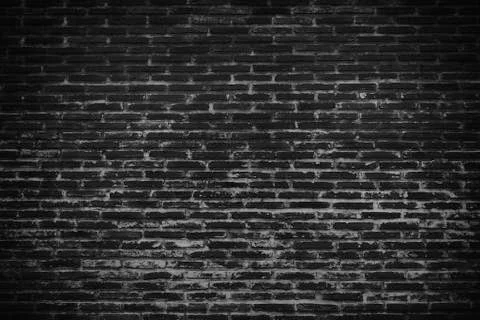 Dark black brick wall surface texture Stock Photos