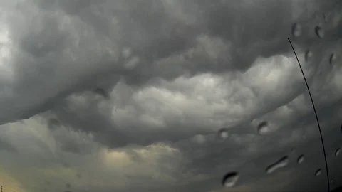 Dark black clouds in the sky moving in ahead of severe thunderstorm Stock Footage 79684316