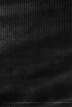 Dark black felt texture with soft fibers and subtle surface variation. Stock Photos
