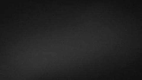 Dark black grainy texture background with subtle gradient blur for 4K tech .. Stock Photos