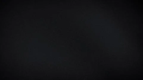 Dark black grainy textured background wallpaper with subtle blur gradient e.. Stock Photos