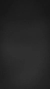 Dark black grainy vertical background texture with subtle abstract tech gra.. Foto stock