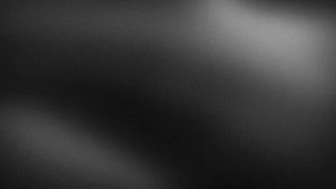 Dark black gray gradient textured background with grainy blur effect for 4K.. Stock Photos