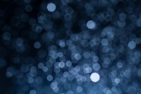 Dark blue abstract background with bokeh. Colorful twinkling lights bokeh lig Stock Photos