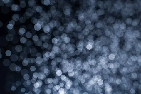 Dark blue abstract background with bokeh. Colorful twinkling lights bokeh lig Stock Photos