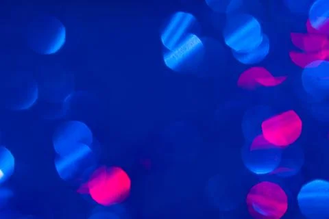 Dark blue background with light effects and white and pink lens flares Stock Photos