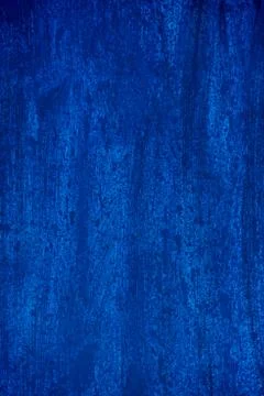 Dark blue background smeared with brushes. Stock Photos