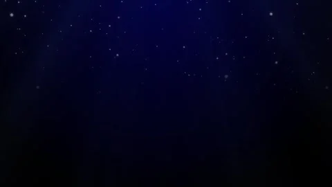 On a dark blue background, white snowflakes fall and disappear in the middle of Stock Footage 284938358