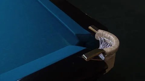 Dark blue billiard table. The ball flies into the hole. Slow motion Stock Footage 229924277