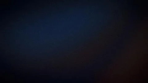 Dark blue black and subtle brown grainy abstract 4K background wallpaper wi.. Stock Photos