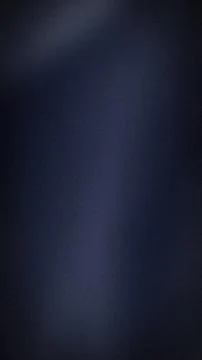 Dark blue blurred grainy texture background vertical format with gradient g.. 스톡 사진