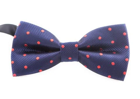 Dark blue bow tie with red polka dots on a white background 库存照片