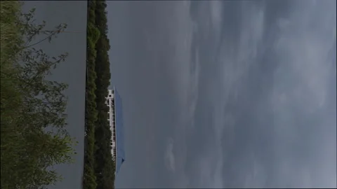 A dark blue building under storm cloud. Stock Footage 159943006