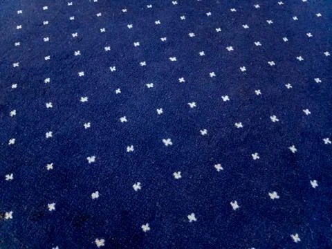 Dark Blue Carpet with White Cross Pattern Stock Photos