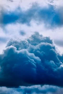 Dark blue cloud in the sky close-up, cloud as a storm warning, approaching st Stock Photos