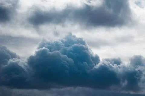Dark blue cloud in the sky close-up, cloud as a storm warning, approaching st Stock Photos
