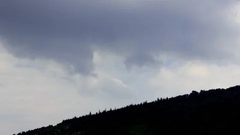 Dark blue clouds on sky time lapse with mountain silhouette Stock Footage 131367260