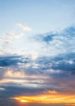 Dark blue clouds on the sunset sky Stock Photos