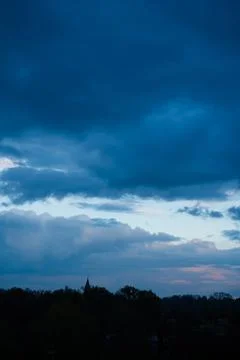 Dark blue cloudy sky background Stock Photos