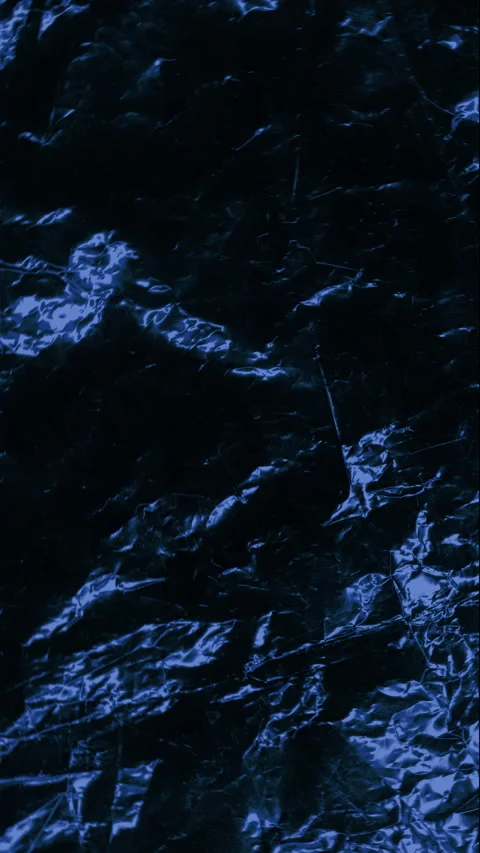 Dark blue crumpled texture slow rotation. 스톡 동영상 336911434