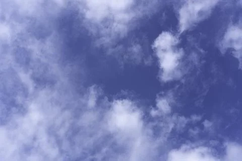 Dark blue evening sky with clouds. Blue hour. Heavenly natural background to  Stock Photos