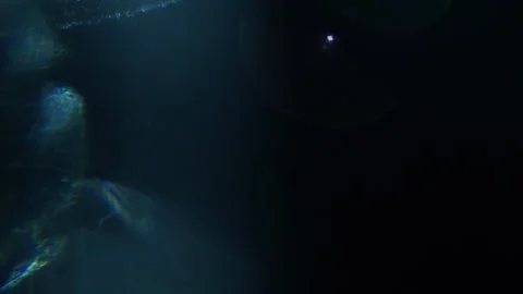 Dark blue glow pulses softly against black void 動画素材 342947658