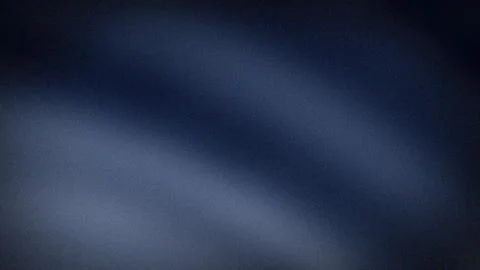 Dark blue gradient abstract grainy textured background with black shades 4K.. Stock Photos
