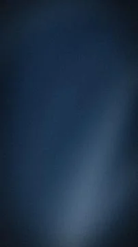Dark blue gradient background with black and gray grainy texture vertical a.. Stock Photos