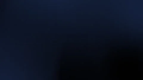 Dark blue gradient seamless loop background with subtle grain texture and grid Stock Footage 297914941