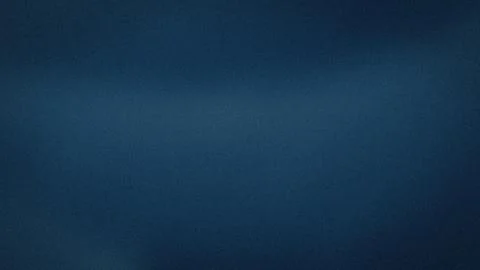 Dark blue grainy texture background with abstract blur gradient for 4K wall.. Foto stock