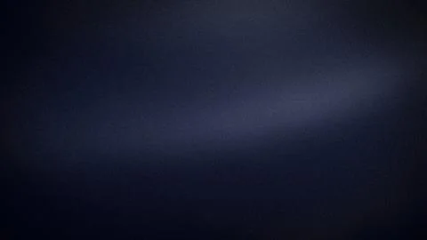 Dark blue grainy textured gradient background with black shades for 4K tech.. Stock Photos