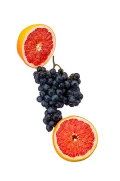 Dark blue grape with red grapefruit isolated on white background Stock Photos
