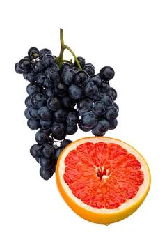 Dark blue grape with red grapefruit isolated on white background Stock Photos