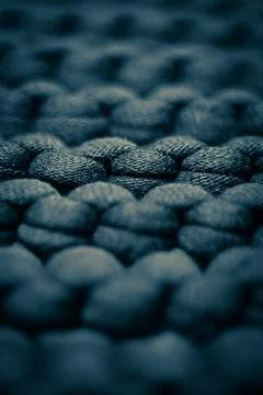 Dark blue grey background massive knitted thread pattern closeup Foto stock