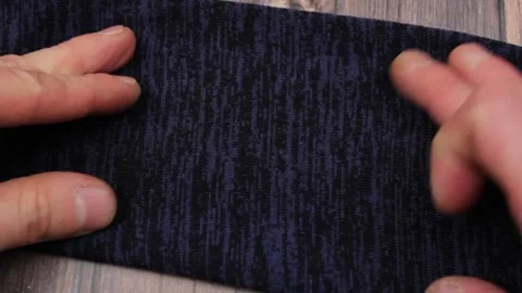Dark blue jacket fabric. Textile dense dark blue sweater. Stock-Footage 172376898